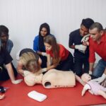 CPR training on manikins during the Red Cross First Aid class.