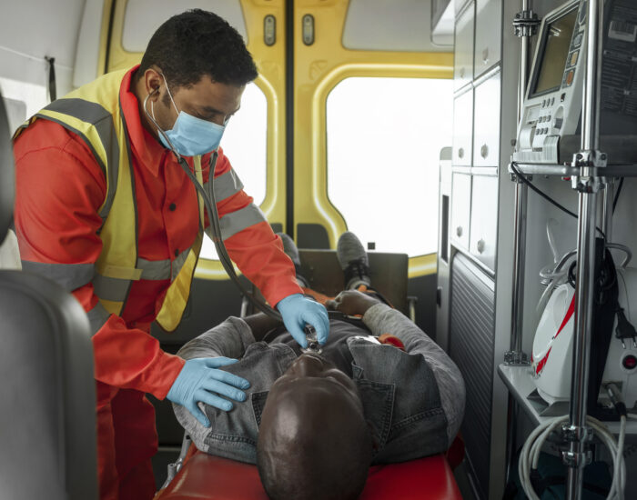 A healthcare professional checking a injured patient's health condition