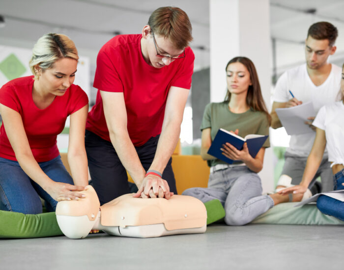 A Trainer Training Student about CPR Treatment